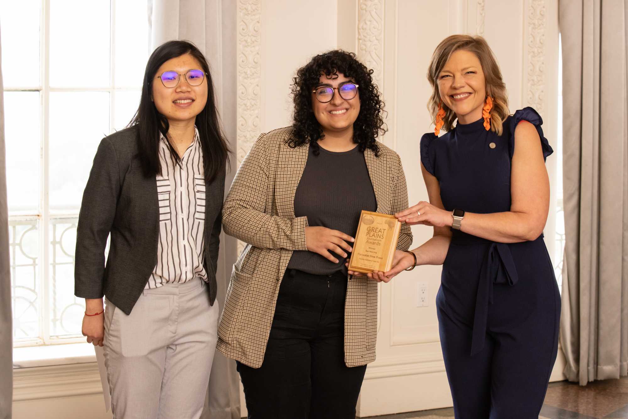 Yanqi Xu and Natalia Alamdari of the Flatwater Free Press accept the award for winning the Beat Reporting category at the 2023 Great Plains Journalism Awards.